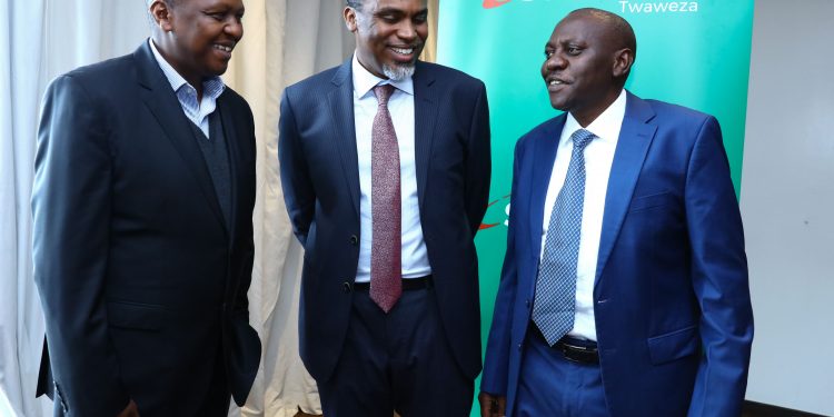 (L-R) Mike Kariuki, HOD Security, Safaricom with DPP Noordin Haji and Safaricom Chief Corporate Security Officer, Nicholas Mulila at the Crowne Plaza Hotel, Nairobi. Safaricom says mobile money fraud reduced from Kshs 90 million to Kshs 20 million last year. www.exchange.co.tz