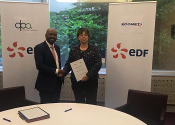 orman Moyo, Group C.E.O of a DPA Africa shakes hands with Marianne Laigneau EDF Senior Executive Vice  President International.