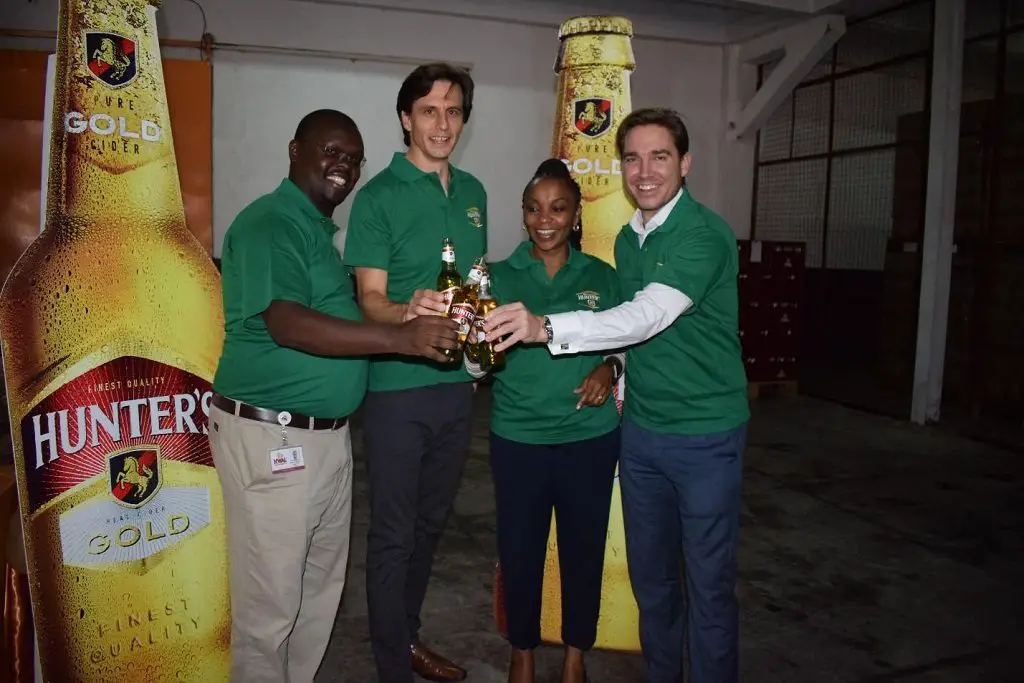KWAL Managing Director Lina Githuka with Supply Chain Director Mwenda Kageenu, Robert Bajner and Board of Director member Chris Lombard. KWAL has started a production line of the Hunters Gold Cider targeting to control 50 per cent of the cider market in Kenya. www.theexchange.africa