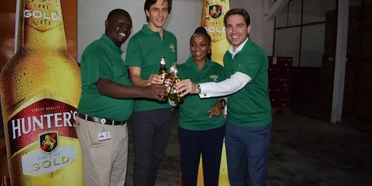 KWAL Managing Director Lina Githuka with Supply Chain Director Mwenda Kageenu, Robert Bajner and Board of Director member Chris Lombard. KWAL has started a production line of the Hunters Gold Cider targeting to control 50 per cent of the cider market in Kenya. www.theexchange.africa