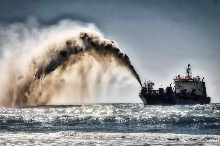 A sand dredger. Sand extraction is fast becoming a transboundary issue due to sand extraction bans, international sourcing of sand for land reclamation projects and impacts of uncontrolled sand extraction beyond national borders. theexchange.africa