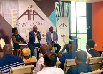 Mr. Andile Ngcaba (centre) speaking to delegates at the 7th Angel Fair Africa event held in Dar es Salaam, on the right is Mr. Ali Mufuruki.