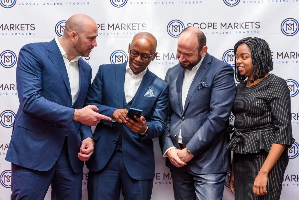 The Scope Markets launch. Kevin Ng’anga- Scope Markets Kenya CEO demonstrates the Scope Platform to Serkan Ismailoglu- Director Scope Markets global while Dianah Igati - Kenya office Legal and Compliance head and Jacob Plattner - Group CEO Scope Markets look on. www.theexchange.africa
