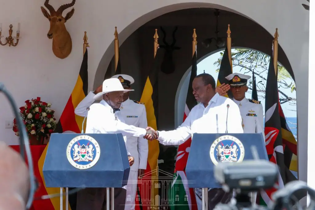Presidents Uhuru Kenyatta (R) and Yoweri Museveni. Kenya and Uganda, two members of the East African Community (EAC) are embroiled in a tussle after Kenya seized products from Uganda. www.theexchange.africa