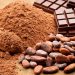 Cocoa Beans and Cocoa Powder with Chocolate Bars on Wood Table www.theexchange.africa