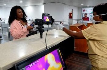 An Nigeria official screening a passenger: BBC:Exchange