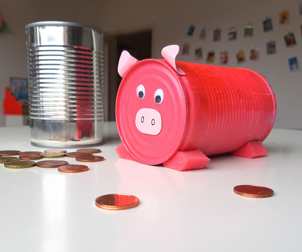 A piggy bank made from a can. Teaching about money at home could start with small steps such as introducing piggy banks. www.theexchange.africa