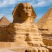 A beautiful profile of the Great Sphinx including the pyramids of Menkaure and Khafre in the background in Giza, Cairo, Egypt: World Travel Guide: Exchange