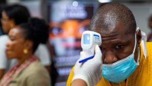 Coronavirus and Tourism, the demise of the African Safari A themometer pointed at a person BBC