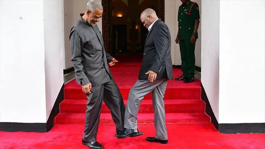 President Magufuli doing a leg gesture amid COVID 19 no hand shaking adherance