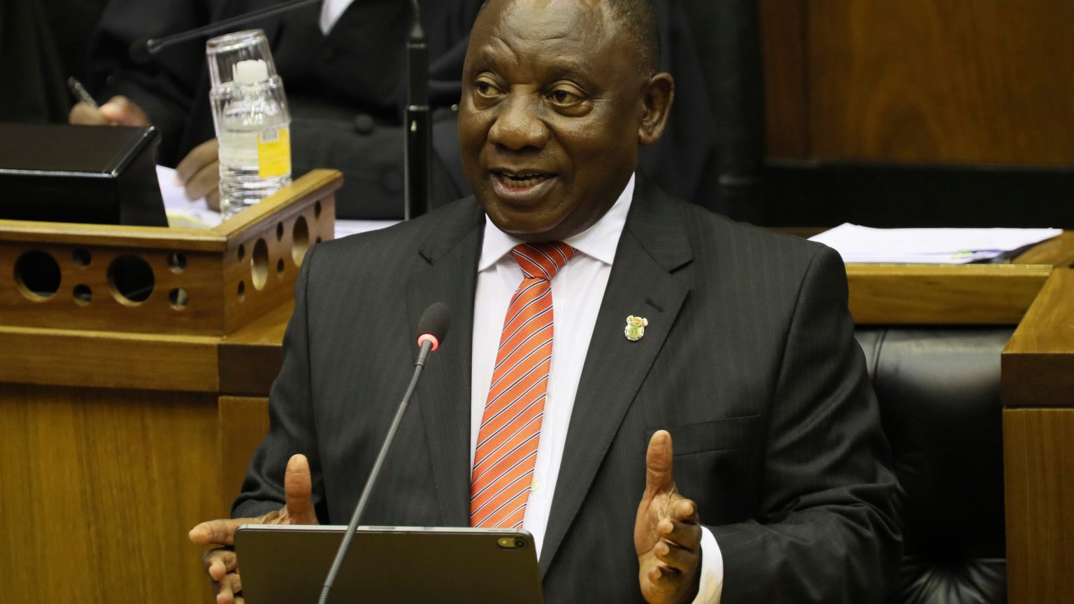South African President Cyril Ramaphos gestures in Parliament Photo Bignhamtonhomepage
