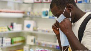 COVID-19 in Africa: Central banks cushioning economy from virus impact A man putting on a face mask DW Exchange