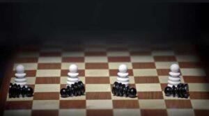 fallen black chess pieces