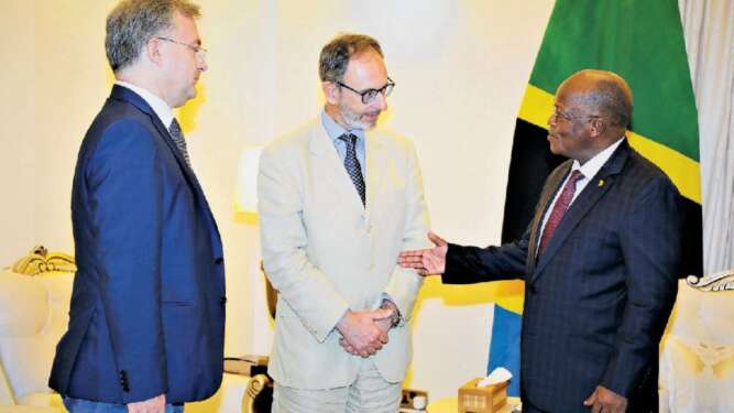 President John Magufuli speaks with the European Union (EU) ambassador to Tanzania, Manfredo Fanti (centre), during their meeting at the State House in Dar es Salaam in 2019. Looking on is the EU deputy head of delegation, Emilio Rossetti - The Exchange (www.theexchange.africa)