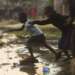 Children playing in an area with raw sewage in Zimbabwe. The Sanitation and Wastewater Atlas of Africa aims to help policymakers accelerate change and investment in the sector. www.theexchange.africa