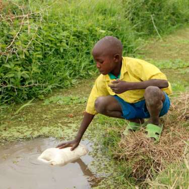 child fetching water 
