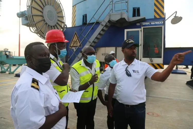 Customs officers prepare to board MV AMU 1 for inspection when it docked on July 15, 2021. The viability of China’s BRI depends heavily on Sub-Saharan African ports. www.theexchange.africa