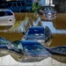 Vehicles submerged in water after torrential rains. Africa suffers the brunt of climate change effects despite being the least GHGs emitter. www.theexchange.africa