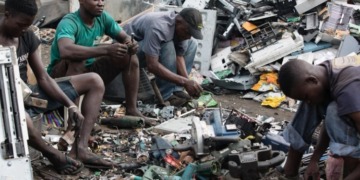 Workers at an e-waste dump in Agbogbloshie, Accra, Ghana. Africa should say no to all forms of dumping including second hand equipment. www.theexchange.africa