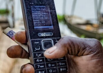 Using mobile money in a market place. www.theexchange.africa