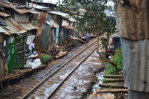 A railway cuts through one of the world's largest slums, Kibera in Nairobi Kenya. www.theexchange.africa