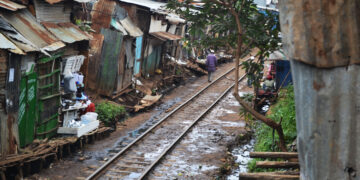 A railway cuts through one of the world's largest slums, Kibera in Nairobi Kenya. www.theexchange.africa