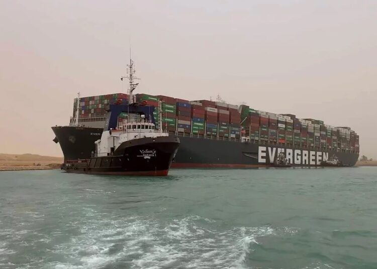 The Ever Given ship being escorted out of the Suez Canal. www.theexchange.africa