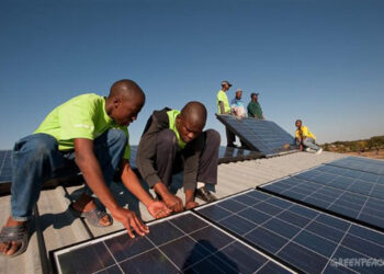 Innovators installing solar panels as  an alternative source of Energy (Photo/Greenpeace)
