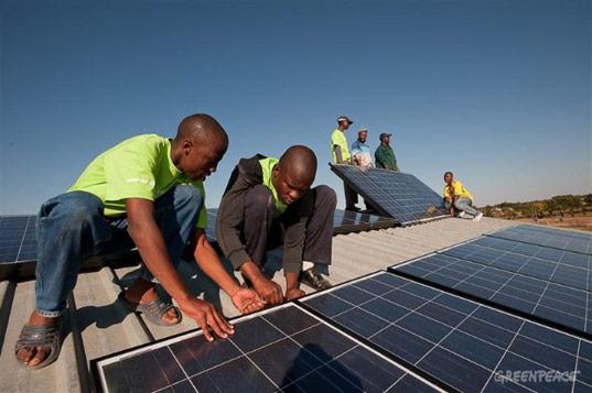 Innovators installing solar panels as  an alternative source of Energy (Photo/Greenpeace)