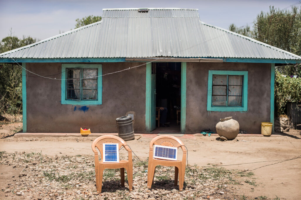 Solar panels charging a light system outside a house in a rural area around Kisumu. www.theexchange.africa