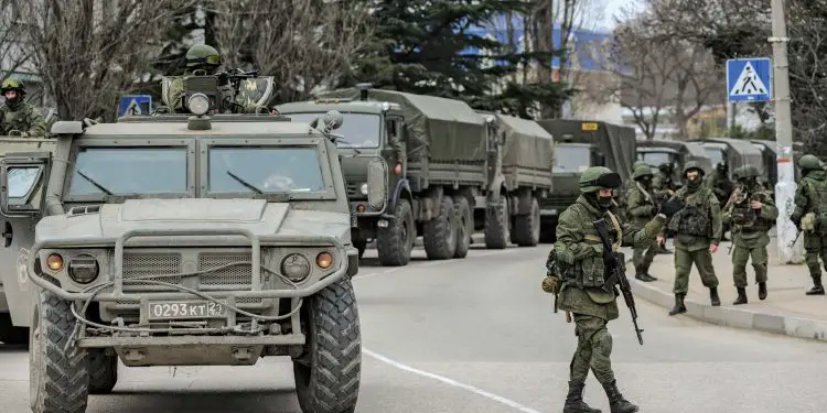 Russian military vehicles patrolling Sevastopol in Ukraine, on March 1, 2014, weeks before Russia annexed Crimea. Putin is seeking to demilitarize, ‘de-NAZI-fy’ Ukraine. www.theexchange.africa