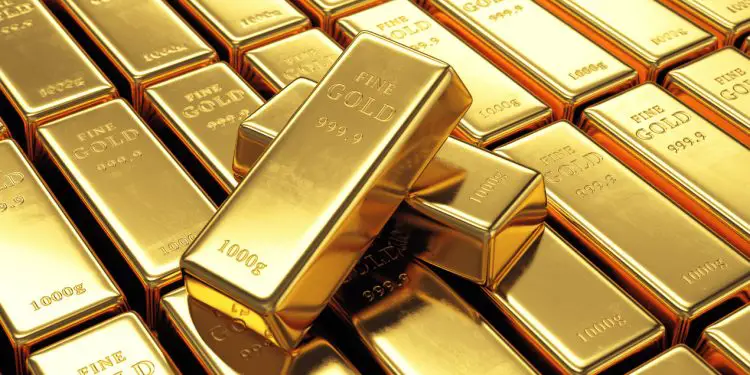 Group of gold bars with two ingots on top. Financial success, business investment and wealth concept. www.theexchange.africa