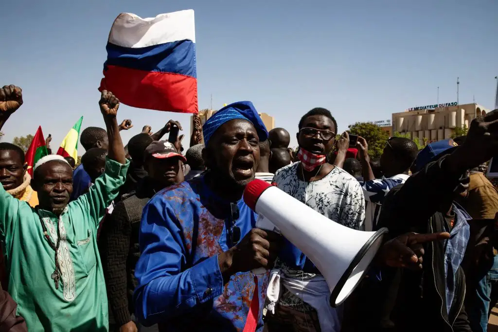 Africans flying a Russian flag in Ouagadougou, Burkina Faso, in January. The US is forcing Africa to support it for its Russia attacks but the continent remains uncommitted. www.theexchange.africa