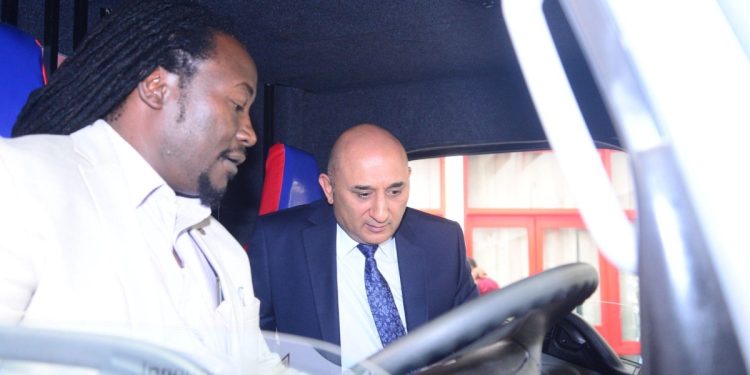 Mehul Sachdev, Pick ups and Buses Product Manager (l) Simba Corp and MetroTrans CEO Oscar Rosanna (r) test out one of the 25 new Fuso buses. Photo: MetroTrans.