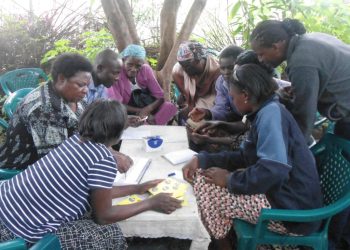 A savings group in Malanga, Kenya. Supporting extended family is hindering many Kenyans from savings. www theexchange.africa