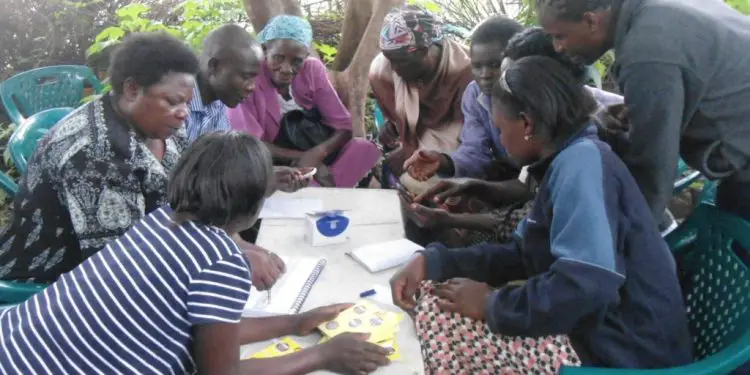 A savings group in Malanga, Kenya. Supporting extended family is hindering many Kenyans from savings. www theexchange.africa