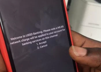 Commercial banks and mobile network providers charge customers a flat rate of N6.98 per transaction every time they use the Unstructured Supplementary Service Data (USSD) service for Nigeria. (Photo/ BBC News)