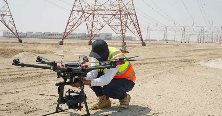 Drones increase inspection efficiency by 80% for utilities and power companies. Drone Pilot operating Drone at powerlines (Photo/ FEDS)