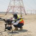 Drones increase inspection efficiency by 80% for utilities and power companies. Drone Pilot operating Drone at powerlines (Photo/ FEDS)