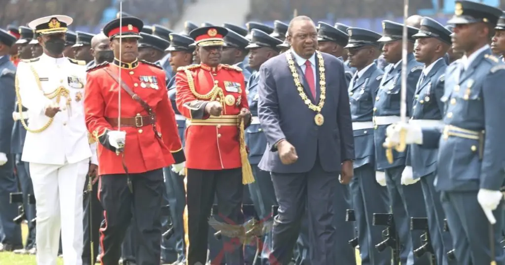 Outgoing Kenyan president Uhuru Kenyatta inspects a guard of honour