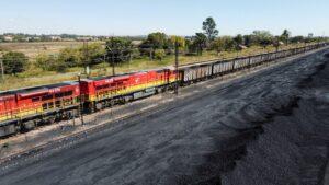 A Transnet Freight Rail train is seen next to tons of coal mined from the nearby Khanye Colliery mine, at the Bronkhorstspruit station, in Bronkhorstspruit, around 90 kilometers north-east of Johannesburg, South Africa. www.theexchange.africa