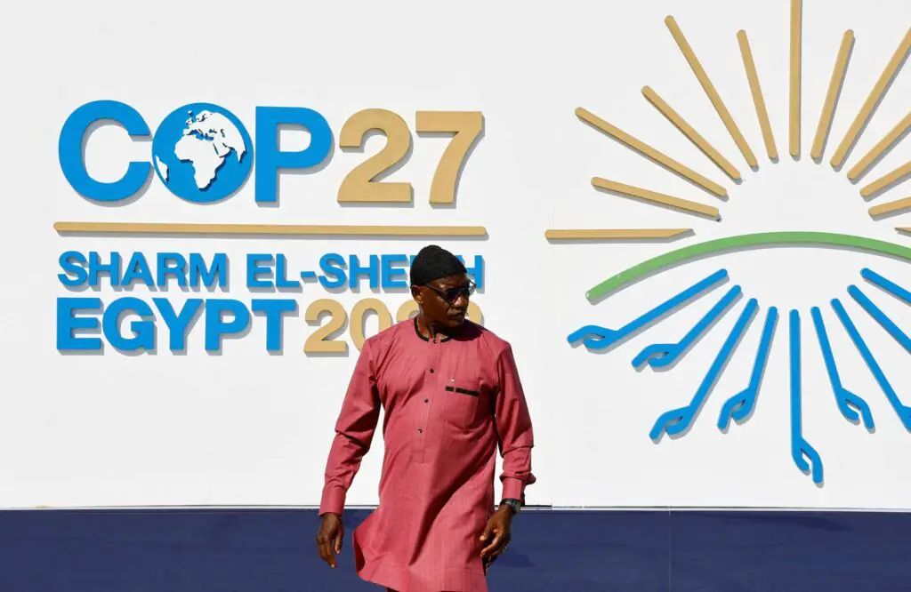 A man walking outside the Sharm el Sheikh International Convention Centre during the COP27 in Egypt climate summit opening. www.theexchange.africa