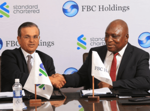 FBC Holdings to acquire Standard Chartered Bank Zimbawe The official announcement took place at Standard Chartered's Headquarters in Harare, Zimbabwe, where representatives from both organizations, Sunil Kaushal of Standard Chartered and Dr. John Mushayavanhu of FBCH, gathered for a momentous signing ceremony. www.theexchange.africa